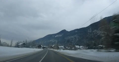 Sped up dashcam POV point of view driving on snowy countryside road Stock Footage 145637420