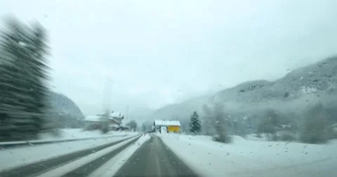 Sped up hyper lapse dashcam POV driving on snowy countryside road in Slovenia Stock Footage 147542018