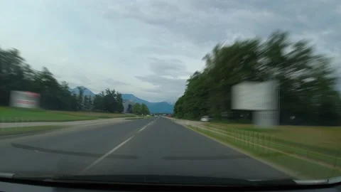 Sped up, hyper lapse view of driving a car on a countryside road, Slovenia Stock Footage 164676784