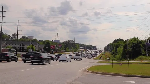 Sped up Traffic front facing jam on a busy highway on a cloudy day at rush ho Stock Footage 153571403