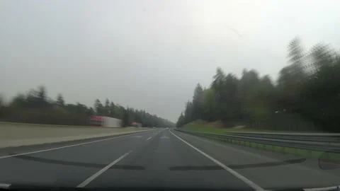 Sped up view of driving a car on the highway in Slovenia Stock Footage 228287847