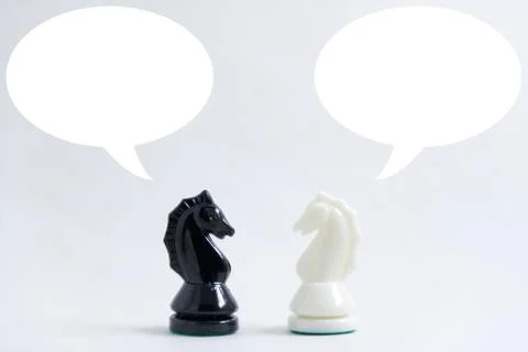 Speech balloon over the chess pieces Stock Photos