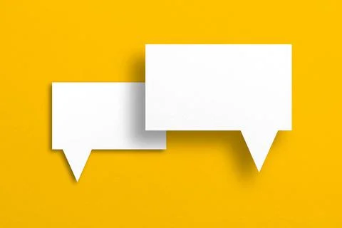 Speech balloon shape white paper isolated on yellow background Stock Photos