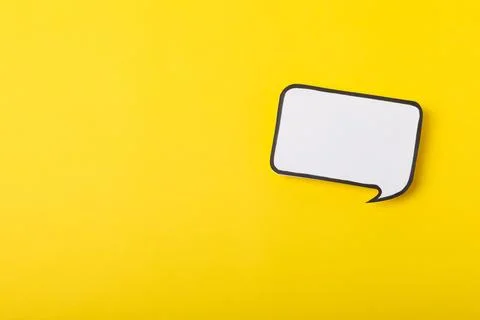 Speech bubble on a bright colored background. Stock Photos