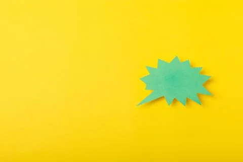 Speech bubble on a bright colored background. Stock Photos