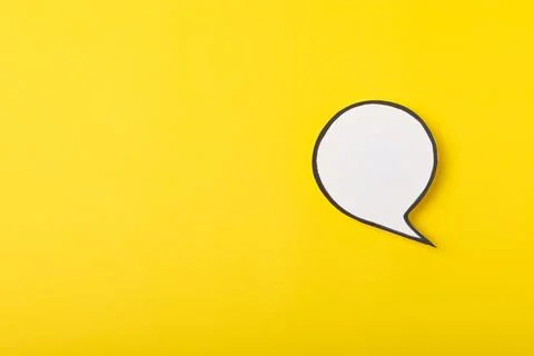 Speech bubble on a bright colored background. Stock Photos