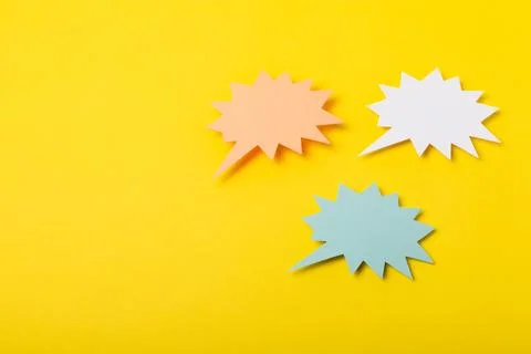 Speech bubble on a bright colored background. Stock Photos