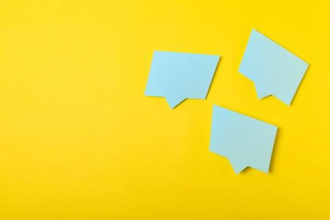 Speech bubble on a bright colored background. Stock Photos