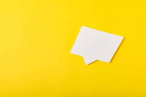 Speech bubble on a bright colored background. Stock Photos
