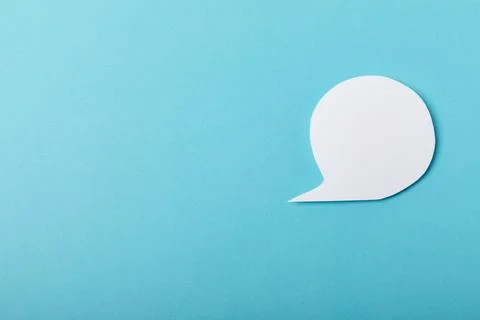 Speech bubble on a bright colored background. Stock Photos