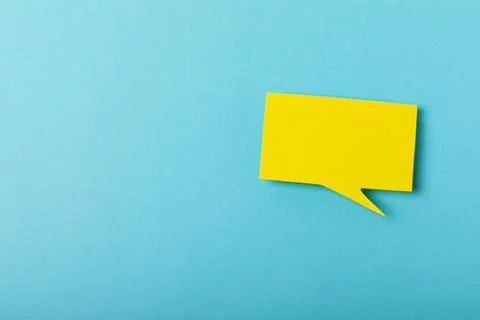 Speech bubble on a bright colored background. Stock Photos