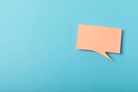 Speech bubble on a bright colored background. Stock Photos