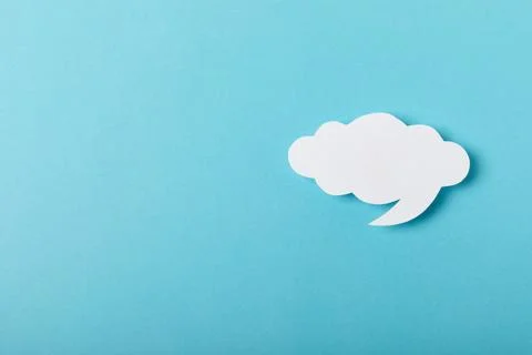 Speech bubble on a bright colored background. Stock Photos