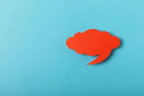 Speech bubble on a bright colored background. Stock Photos