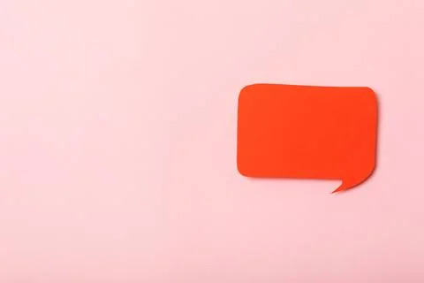 Speech bubble on a bright colored background. Stock Photos