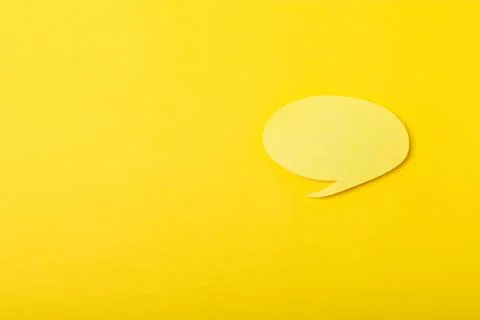 Speech bubble on a bright colored background. Stock Photos