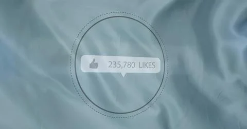 Speech bubble floating in circular ring over blue cloth, displaying thumbs-up Stock Photos