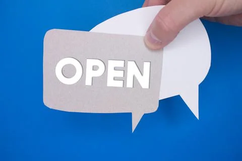 Speech bubble in front of colored background with Open text. Stock Photos