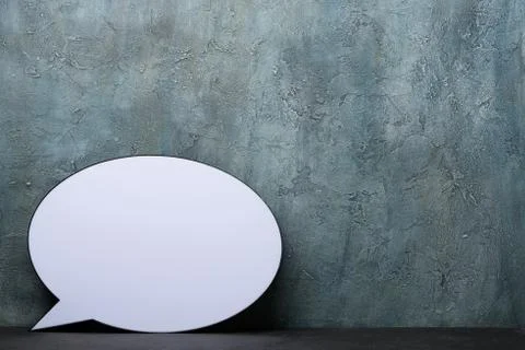 Speech Bubble lightbox on desk. Plastic light box in form of chat message ico Foto stock