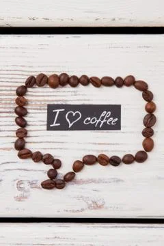 Speech bubble made from coffee beans with I love coffee message. Stock Photos