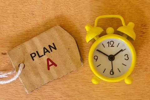 Speech bubble note written with PLAN A with clock. Business and education con Stock Photos