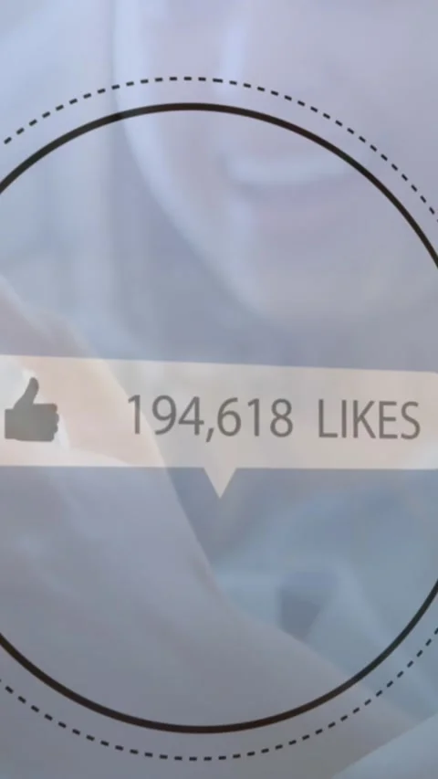 Speech bubble with thumbs up icon and increasing numbers against woman using Stock Footage 343714134