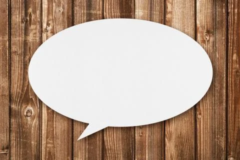 Speech bubble on wooden background Stock Photos