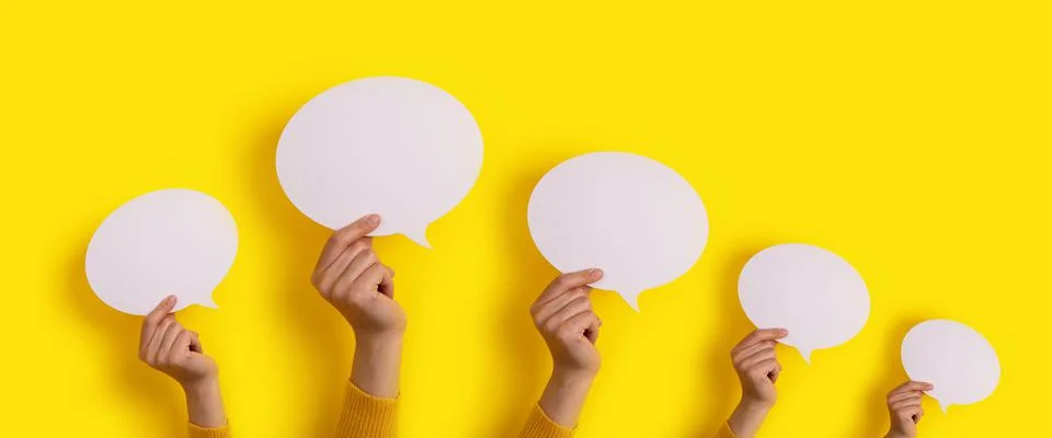 Speech bubbles in hand panoramic Stock Photos