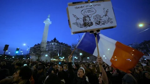 Speech &amp; Flag - Paris Demonstration after Charlie Hebdo shooting Stock Footage 100375655