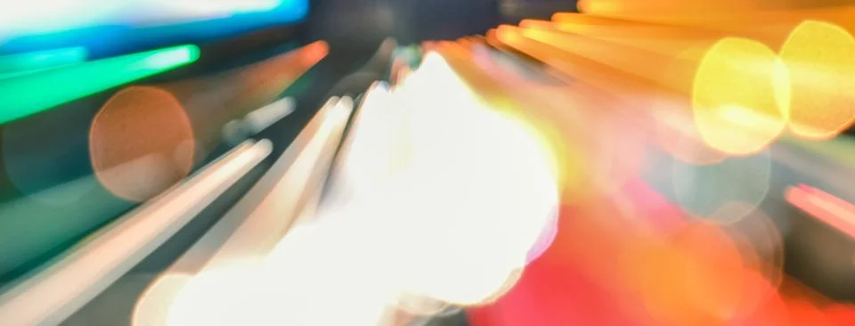 Speed accelerating blurred motion abstract multicolored background Stock Photos