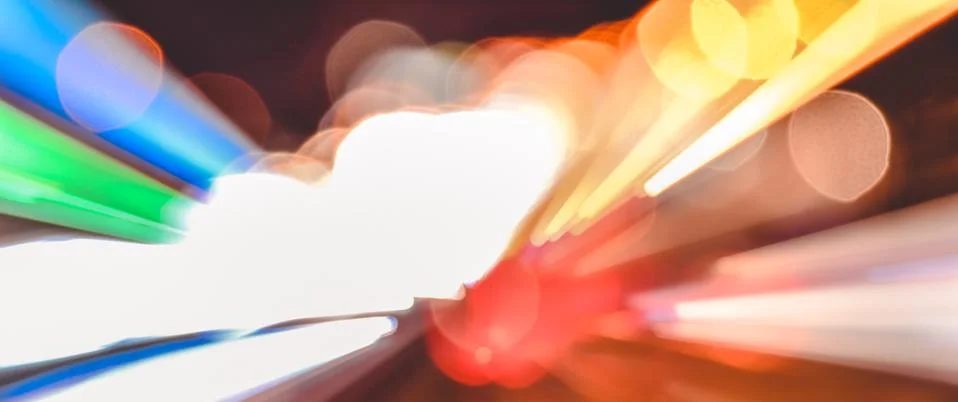 Speed accelerating blurred motion abstract multicolored background Stock Photos