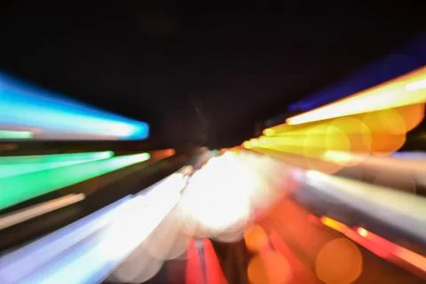 Speed accelerating blurred motion abstract multicolored background Stock Photos
