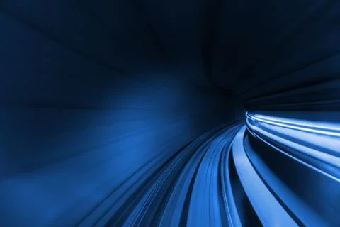 Speed blurred motion of train or subway train moving inside tunnel. Stock Photos