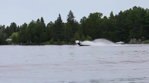 Speed boat bouncing on lake Stock Footage 52159864