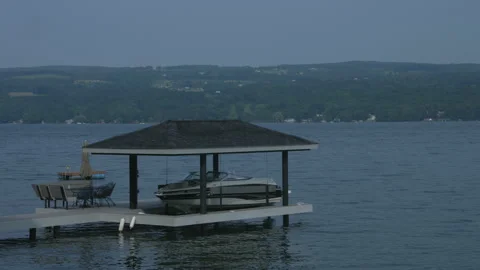 Speed Boat On Dock In Lake Video stock 138333568