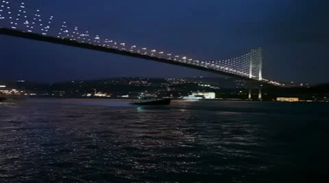 Speed boat passing under the bosphorus bridge HD 1080p Video stock 10881886