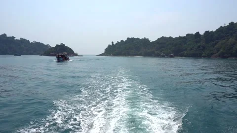 The speed boat quickly sails creating waves behind Stock Footage 152510592