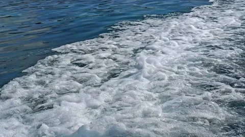 Speed boat raise waves in blue sea water. Stock Footage 304575416