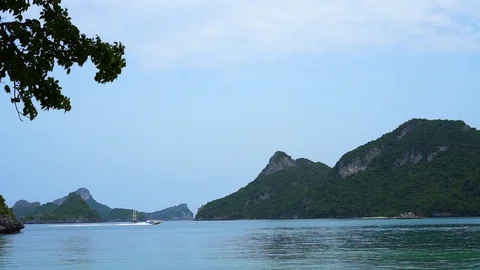 Speed boat speeding through tropical islands Stock Footage 117297166