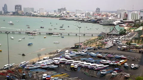 Speed boat yard beach and city skyline Asian holiday resort city Vidéo 48978166