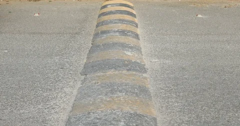 Speed bump on a road Stock Footage 74835070
