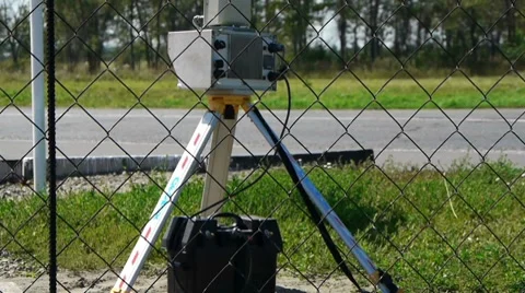 Speed camera at the side of the road with blurred cars passing Stock Footage 8538830