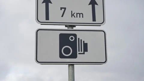 Speed camera sign showing 7 km ahead mounted on metal pole Video stock 319293519