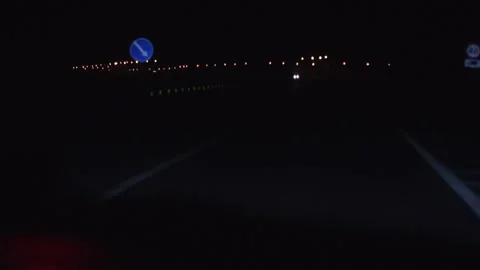 Speed control camera flashing on the night road. View from car driver. Hand hold Stock Footage 271231150