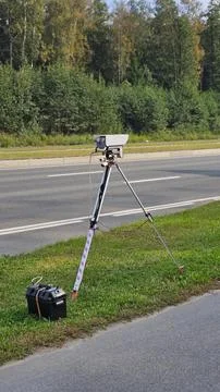 Speed control camera installed on the road against Stock Photos