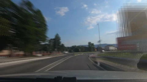 Speed up dashboard dash cam point of view POV driving in small town Vipava Stock Footage 138589024