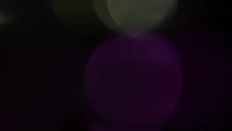 The speed of light of white and purple bokeh floating in the blackness Vídeo Stock 309765990