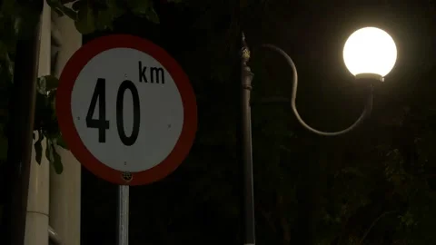Speed limit 40 km/h sign, Indonesian road signage at night Stock Footage 139547225