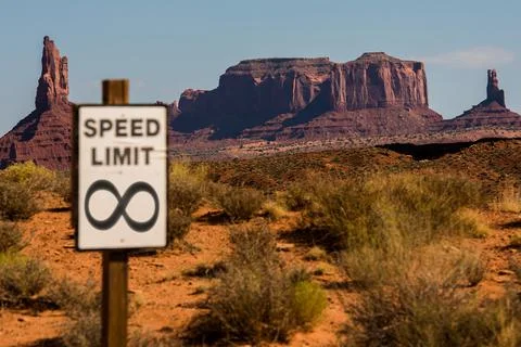 Speed limit infinity with Monument Valley mesas in the background Stock Photos