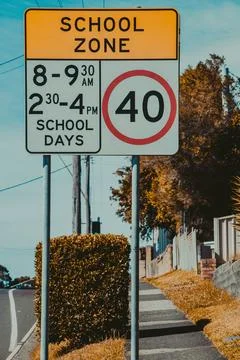 Speed Limit School Zone Sign On A Clear Day Near A Quiet Neighborhood Stock Photos